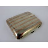 Silver cigarette case shaped to fit pocket by A & J Zimmerman, Birmingham 1938, W 115g