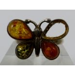 Sterling silver and amber butterfly ring missing one stone. Size P/Q