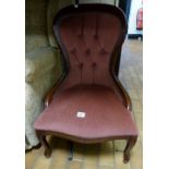 Red upholstered button back spoonback chair