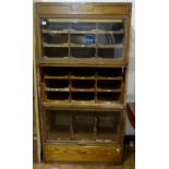 Vintage tailors cabinet with three glass up and over counterweighted fronts 188 x 98 cm.