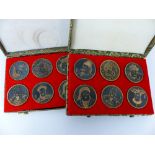 Two boxed sets of Oriental tokens