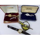 Three vintage ladies watches and a Celtic agate brooch