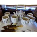 Saki set with pot and six cups, and set of caviar spoons