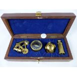 Wooden cased miniature brass compass and nautical instruments - sextant etc