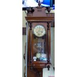 Inlaid mahogany cased chiming wall clock with key and pendulum. Working at lotting up.