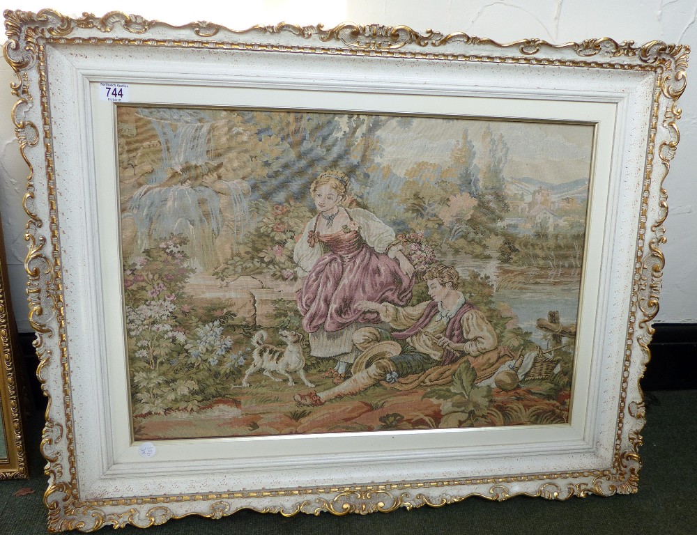 Gilt framed embroidered picture, lady, gent and dog at riverside