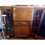 Oak side by side bureau with leather inlay to writing slope with one drawer and one cupboard