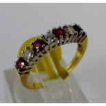 Ruby and diamond 18ct yellow gold ring, size J/K. W: 2.18g