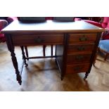 Oak kneehole desk with brown leather inlay top and five drawers