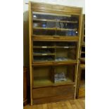 Vintage tailors cabinet with three glass up and over counterweighted fronts 200 x 100 cm