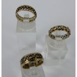 Three gold and silver rings, two size J and one size K