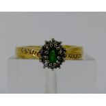 18ct gold emerald and diamond cluster ring with diamond set shoulders, Size Q/R