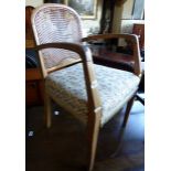 Upholstered rattan back armchair