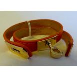 Double orange leather wraparound bracelet with yellow metal clasp