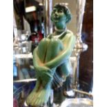 Art Deco figurine of a seated 1930s lady