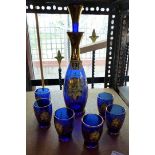 Bristol blue decanter and six glasses with hand painted floral detail