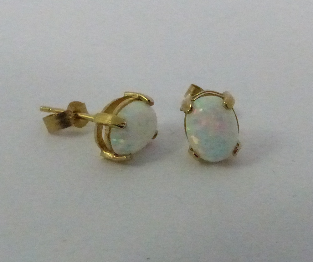 Pair of  9 ct gold and opal earrings