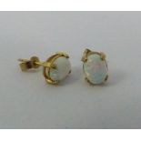 Pair of  9 ct gold and opal earrings
