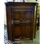 Oak wall hanging corner cupboard with carved detail, H ~ 77cm