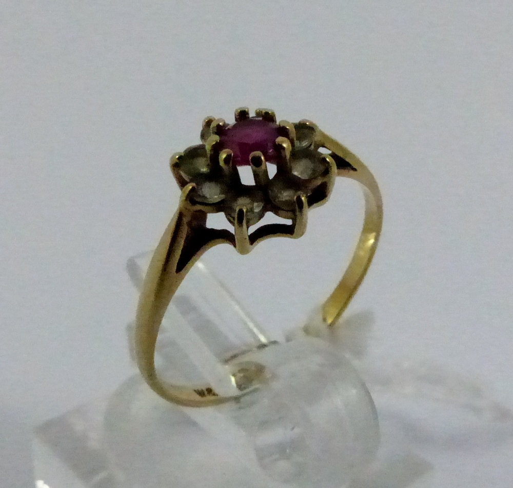 Ladies 9ct gold flower ring, ruby and white stones design, size M