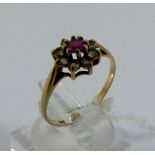 Ladies 9ct gold flower ring, ruby and white stones design, size M