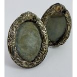 Pair of small oval Art Nouveau hallmarked silver photograph frames, H ~ 9cm, A/F