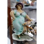 Wonderful World Graceful Motion figurine of voluptious lady on bike, boxed