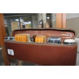 Pigskin case of male accessories, chrome canister, clothes brushes etc