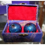 Pair of Oriental decorative balls in case