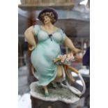 Wonderful World Graceful Motion figurine of voluptious lady on bike, boxed