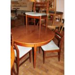Oak circular extending dining table with four chairs