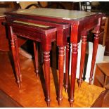 Mahogany nest of three tables with green leather inlay to top