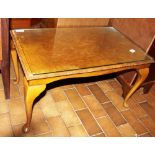 Walnut coffee table with glazed top on cabriole feet
