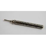 Sampson Morden white metal retracting pencil, engraved with foliate scrolls, stamped with diamond