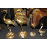 Four brass ducks