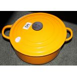 Two Le Creuset casserole dishes with lids