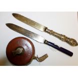 Knife marked Wembley 1924 to blade, one other and Treble 534 court measure