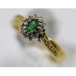 18ct gold emerald and diamond ring, size Q