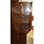 Old Charm style oak glazed corner unit with linenfold detail to doors