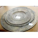 Three graduated Eastern brass plates