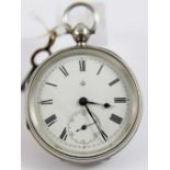 Silver pocket watch with key, working at lotting up