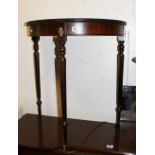 Mahogany half moon table on turned legs