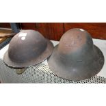 Two WWII 1941 dated steel helmets