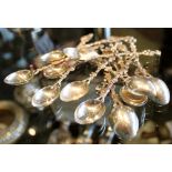 Twelve 900 silver French spoons with armourial handles and pickle forks, one A/F, 90g