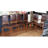 Set of six light oak dining chairs with carving to back and studded upholstery on tapered legs