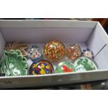 Seven glass paperweights and four pieces of Wade ceramics