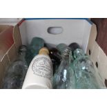 Box containing various mixed vintage glass bottles