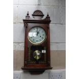 Mahogany cased chiming wall clock with pendulum