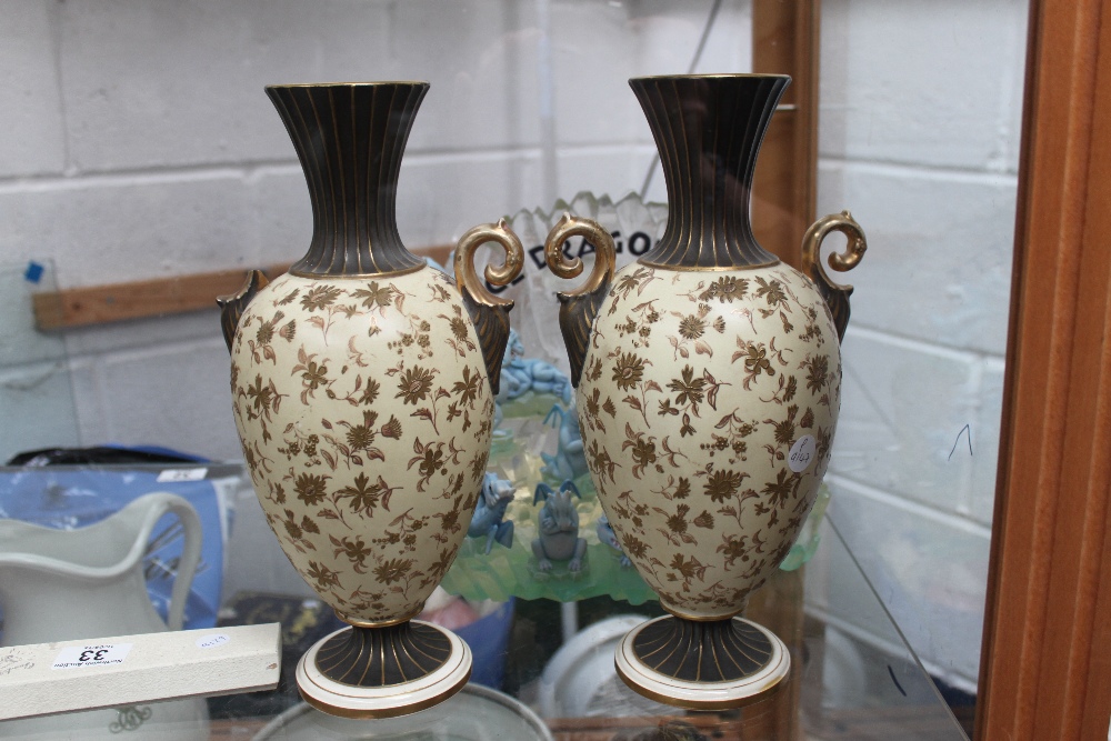 Pair of twin handled vases A/F