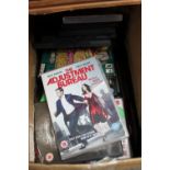 Box of CDs and DVDs including The Adjustment Bureau